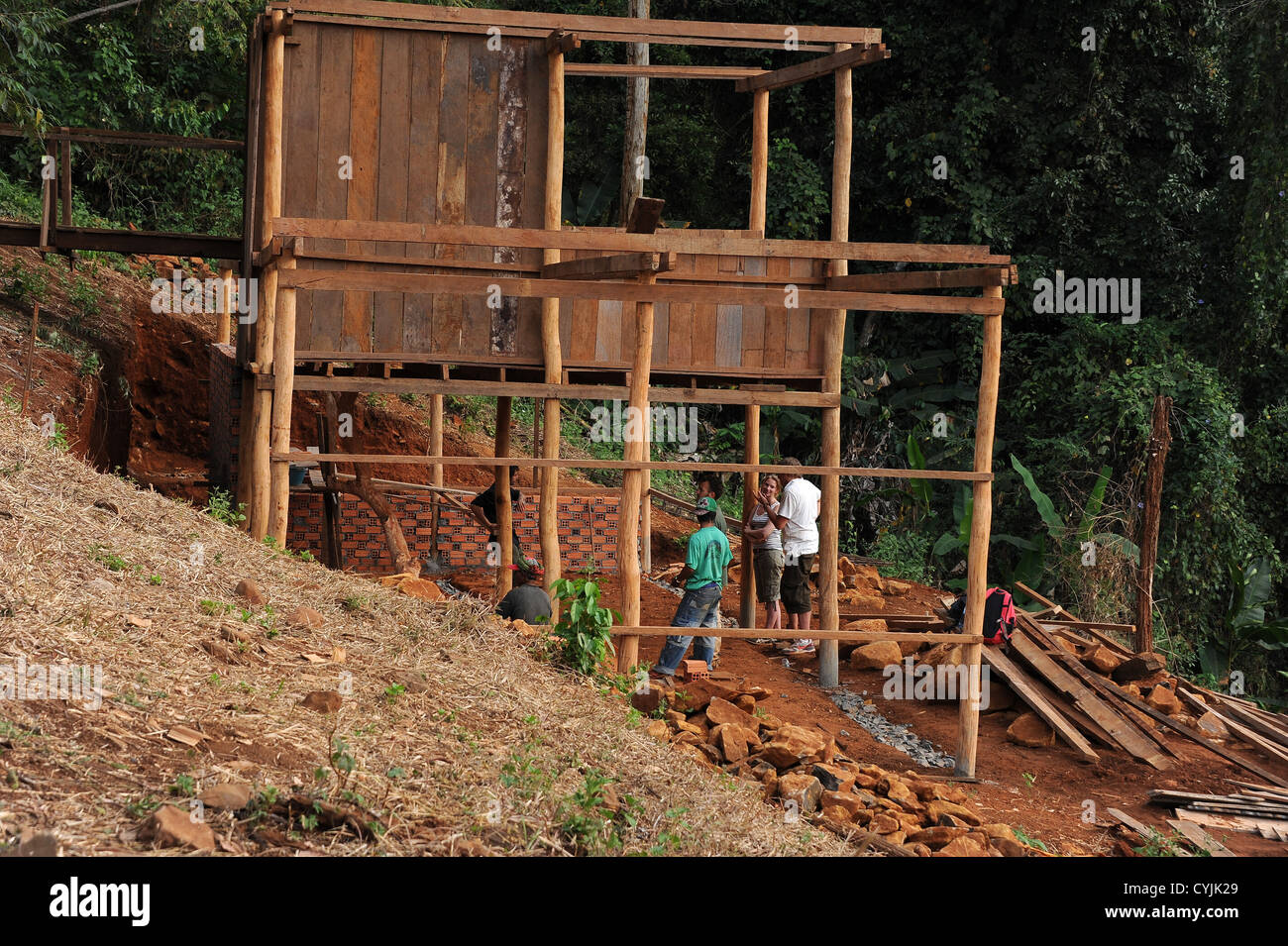 Managers meet on site to discuss progress of new building . Cambodia. Stock Photo