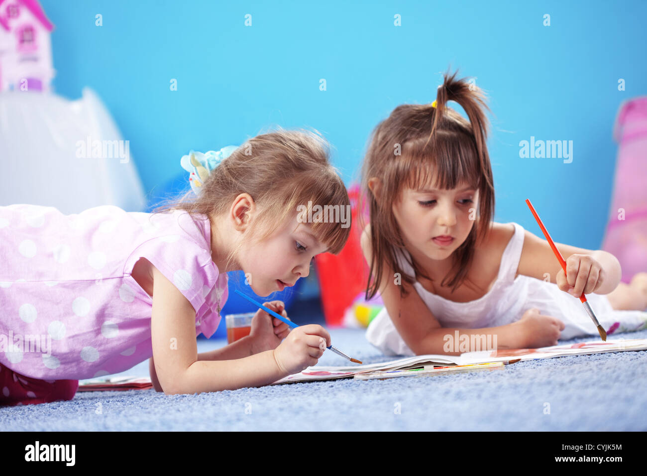 Children drawing in the nursery Stock Photo - Alamy