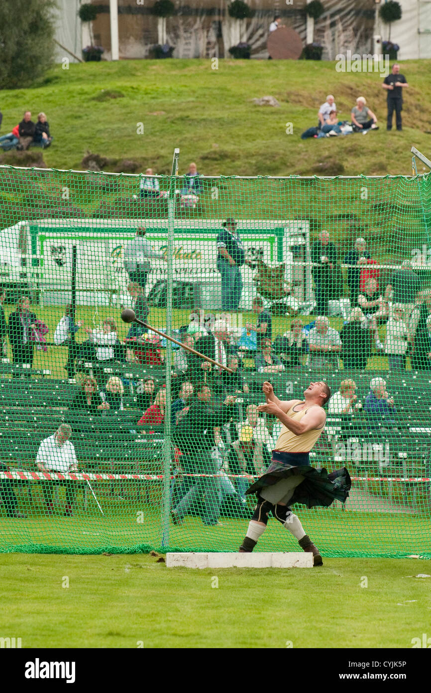 Hammer throwing at Highland Games. Braemar Highland Games Stock Photo