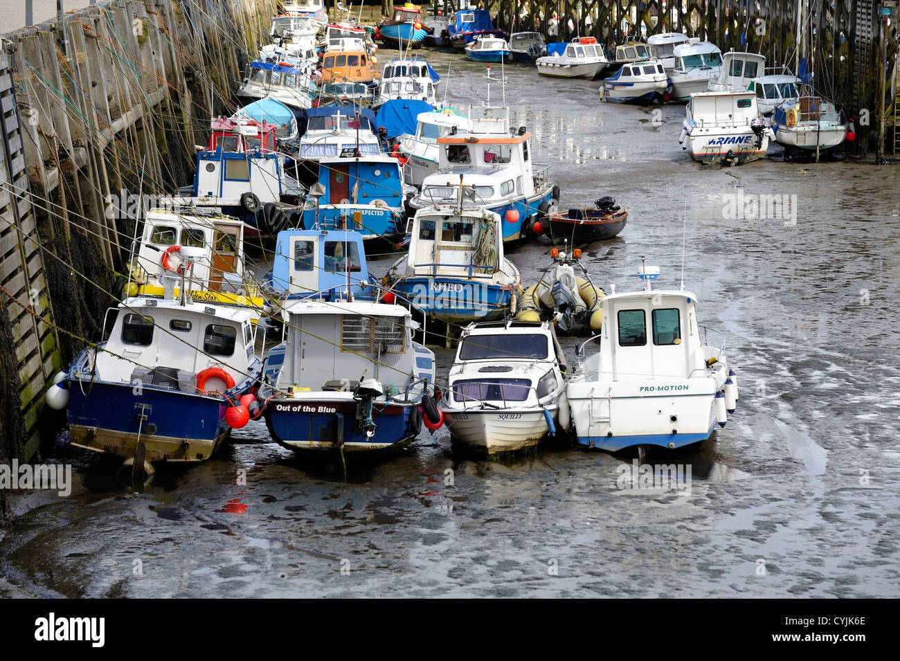 fishing boats in the harbour at low tide Scarborough north Yorkshire england uk Stock Photo