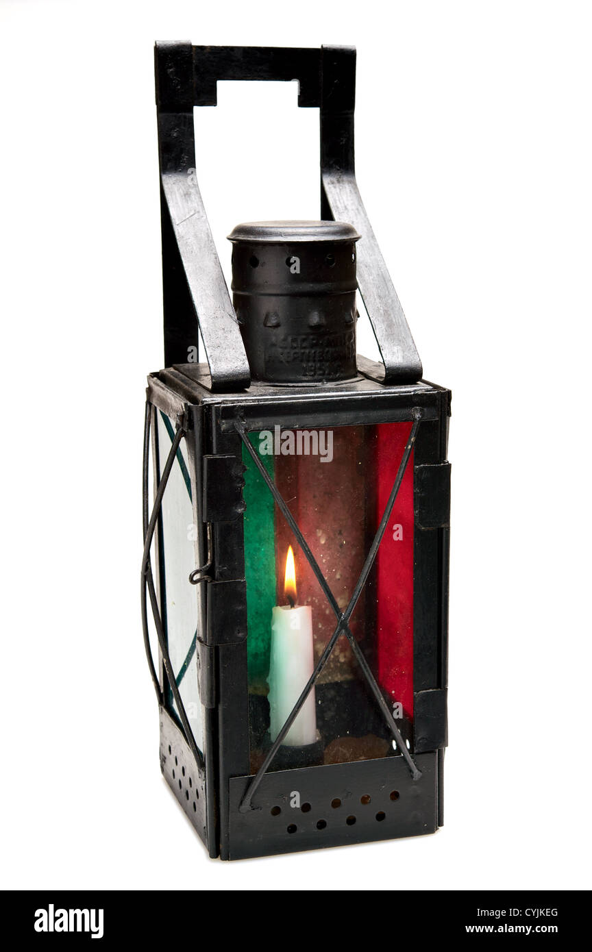 Oldfashioned lantern with candle inside. Isolated on white background
