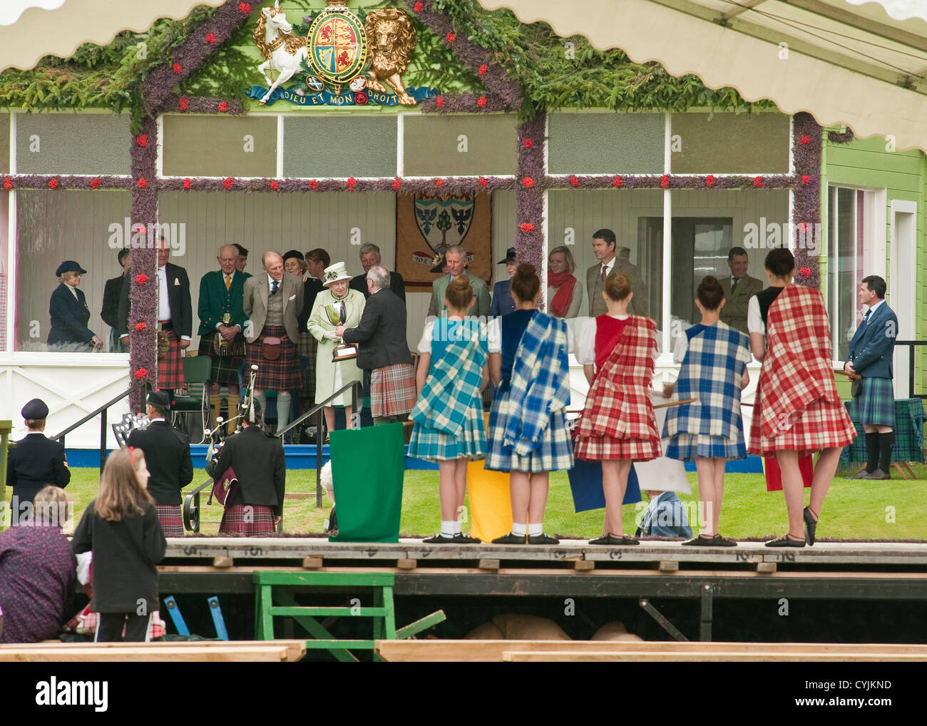 Young Scottish Highland dancers awaiting presentation of awards from the HM Queen. Braemar Highland Games. Stock Photo