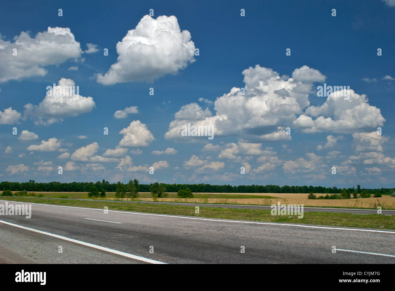 Empty road and cloudy blue sky Stock Photo - Alamy