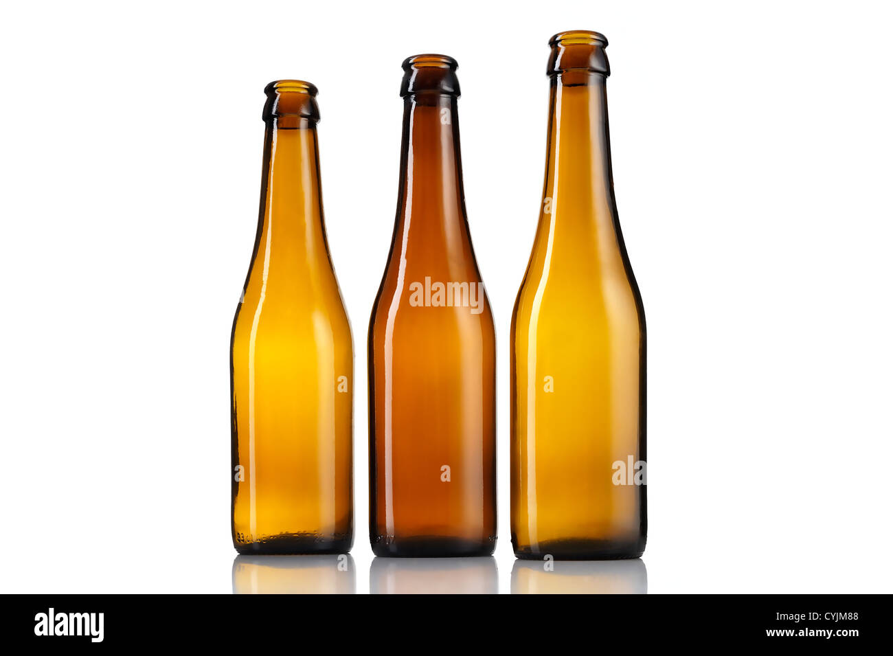 Three empty bottles of beer isolated on white background. Stock Photo