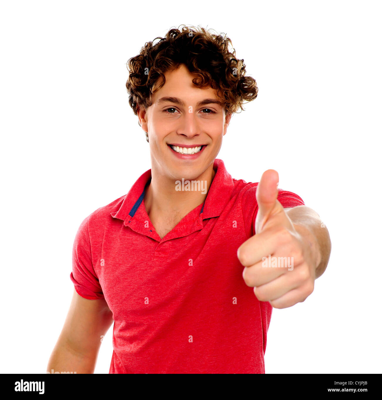 Handsome young man gesturing thumbs-up isolated on white Stock Photo
