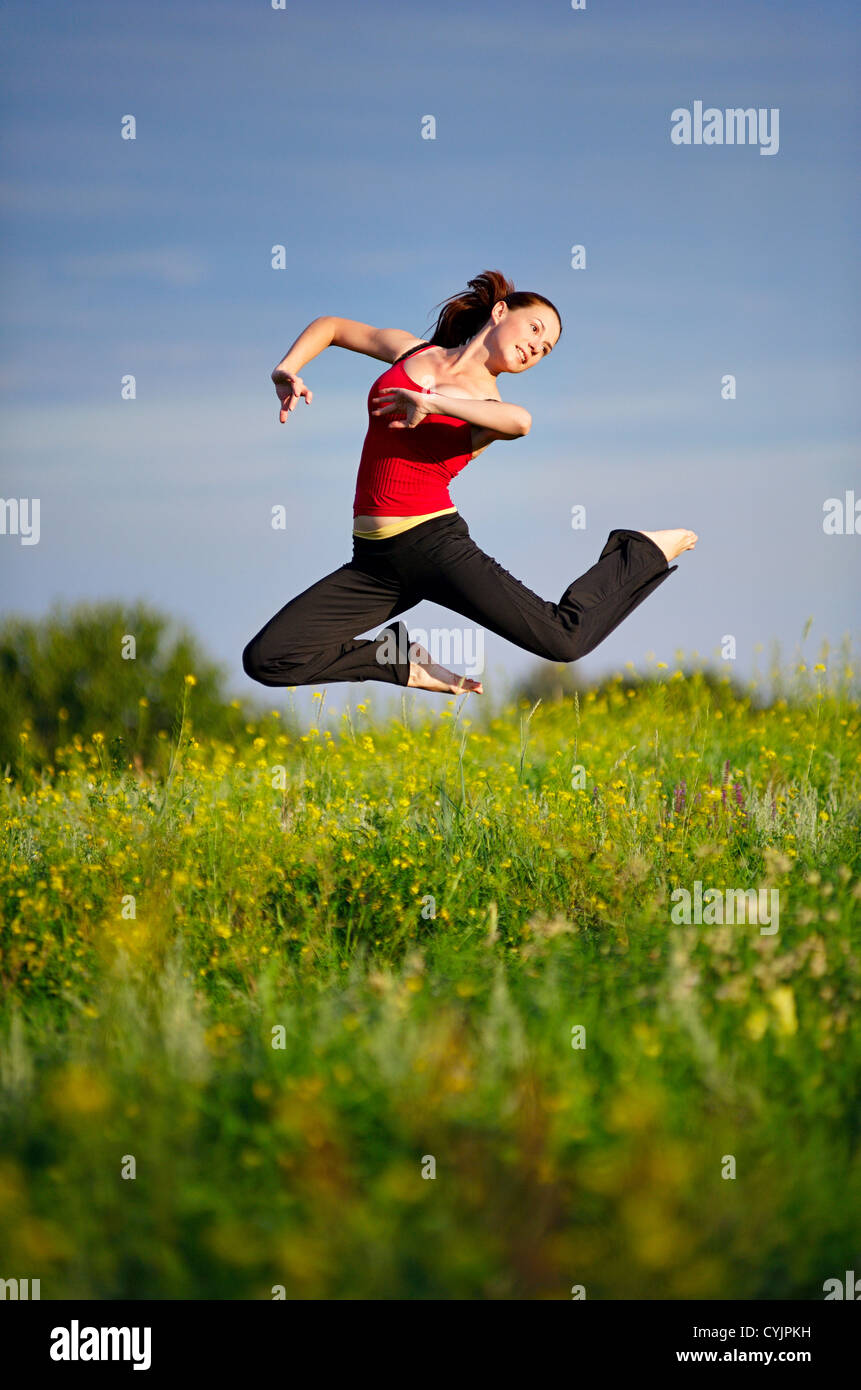 Woman Jumping On A Sunset Stock Photo Alamy