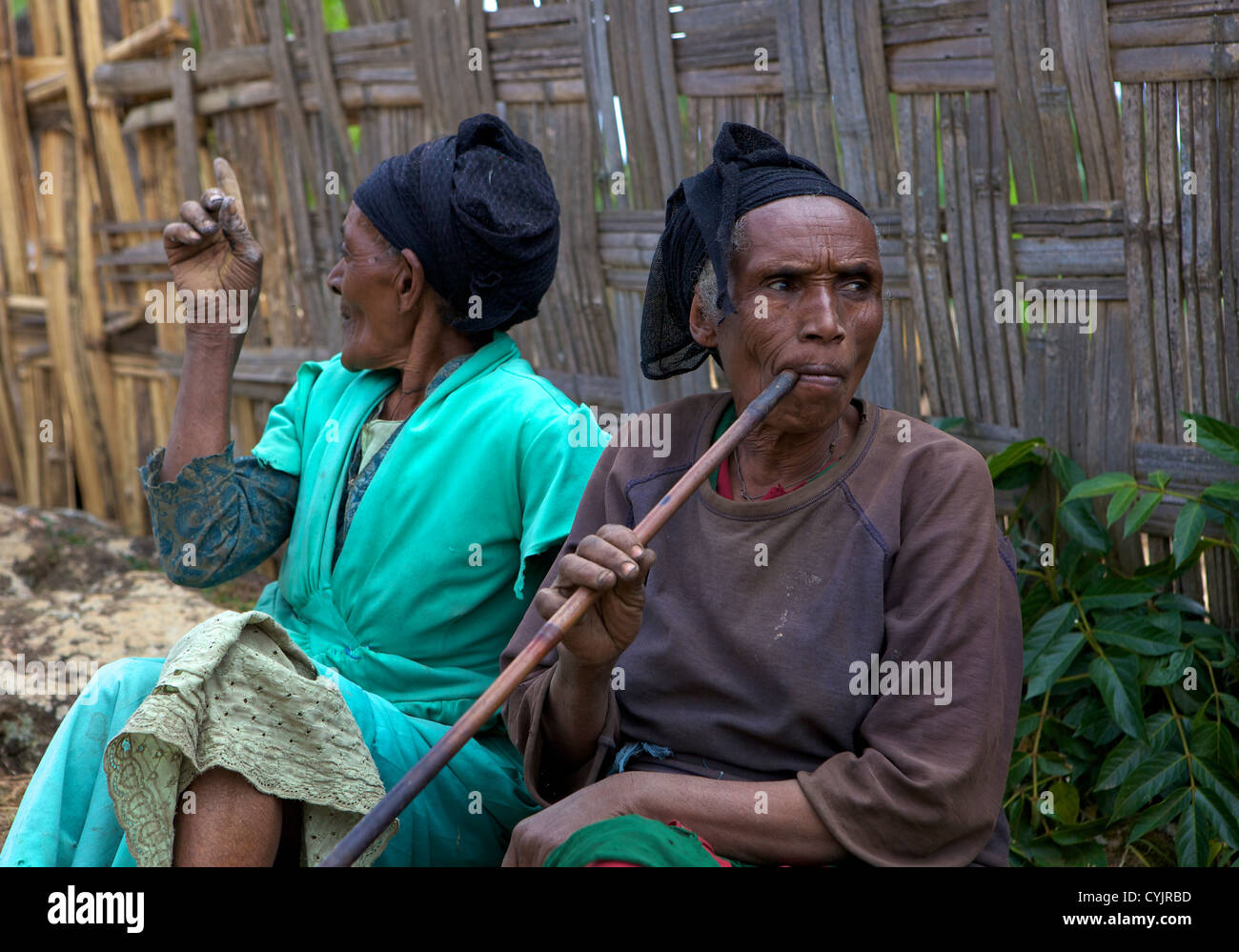 Local ladies smoking a pipe, Chencha, Dorze, Ethiopia Stock Photo