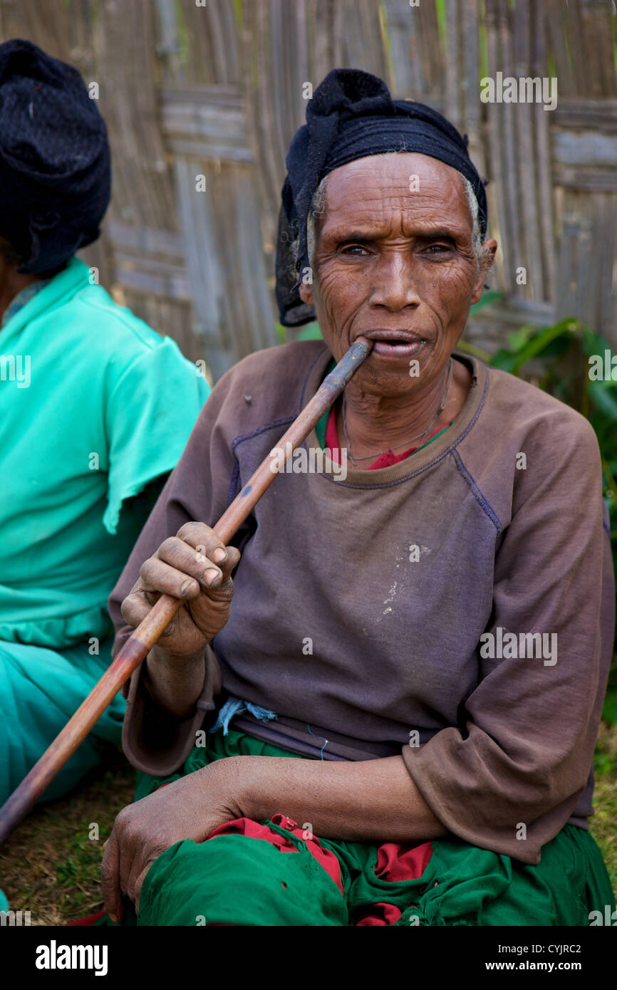 Local ladie smoking a pipe, Chencha, Dorze, Ethiopia Stock Photo