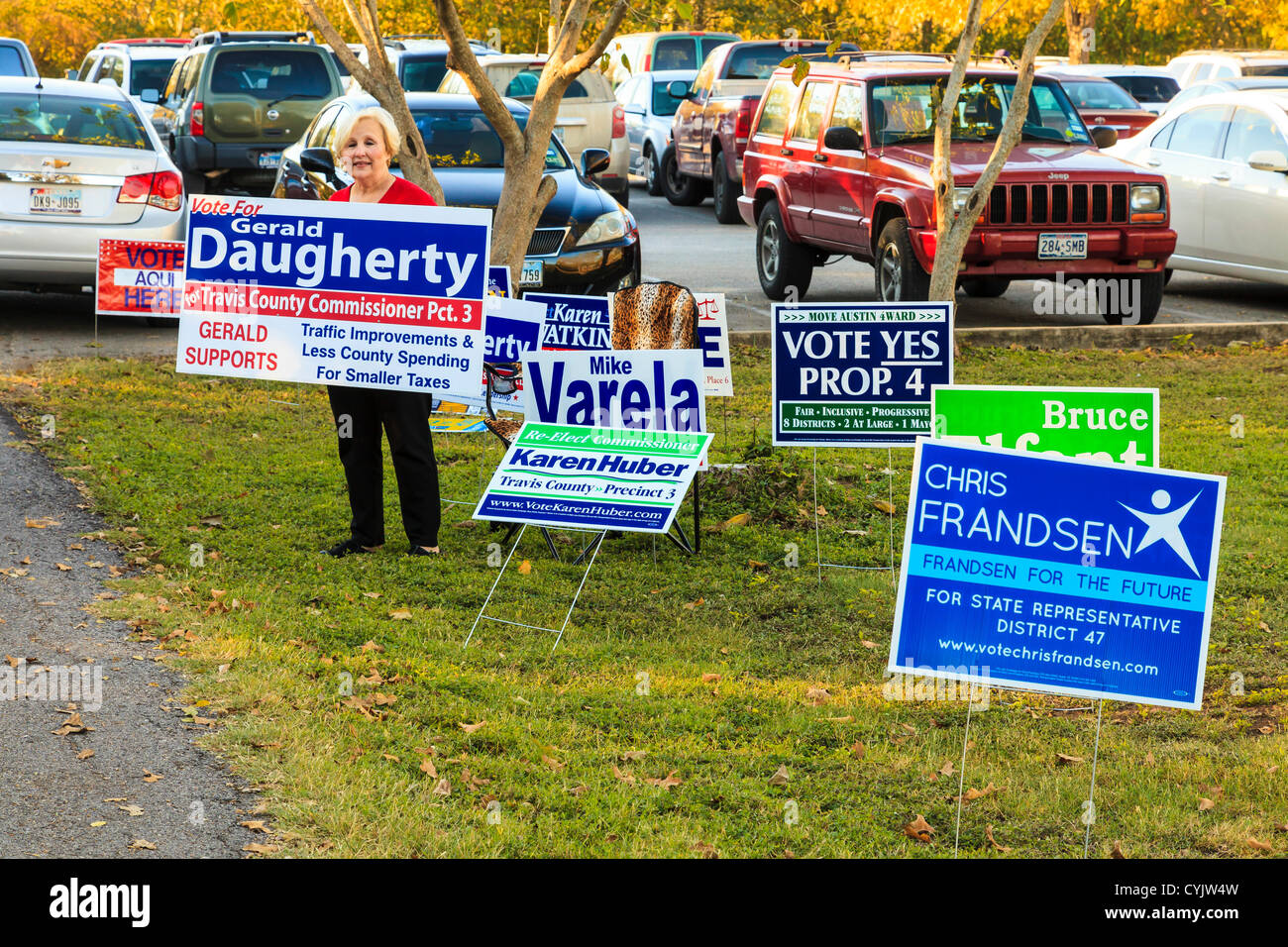 Judy Pittsford campaigns for the county commissioner Pct 3 outside a polling station as voting opens. Keeping 100ft distance from the polls. Manchaca Methodist Church south Austin, TX. More than a presidential election, local, state wide votes on the ballot sheet. Stock Photo