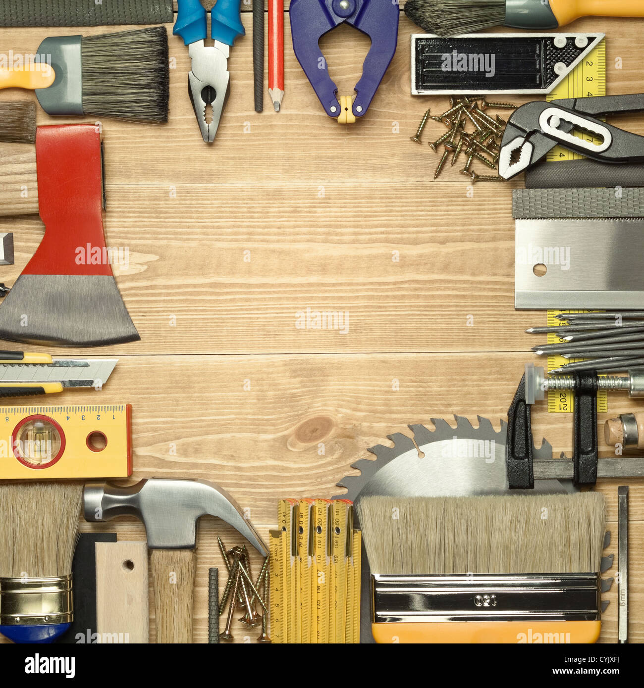 Carpentry tools on a wooden board. Stock Photo