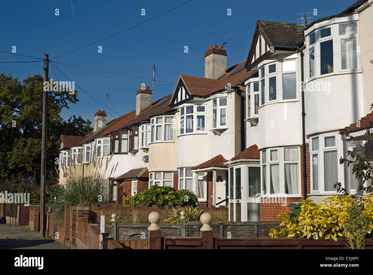 terrace of 1930s houses with bay windows, whitton, middlesex, england