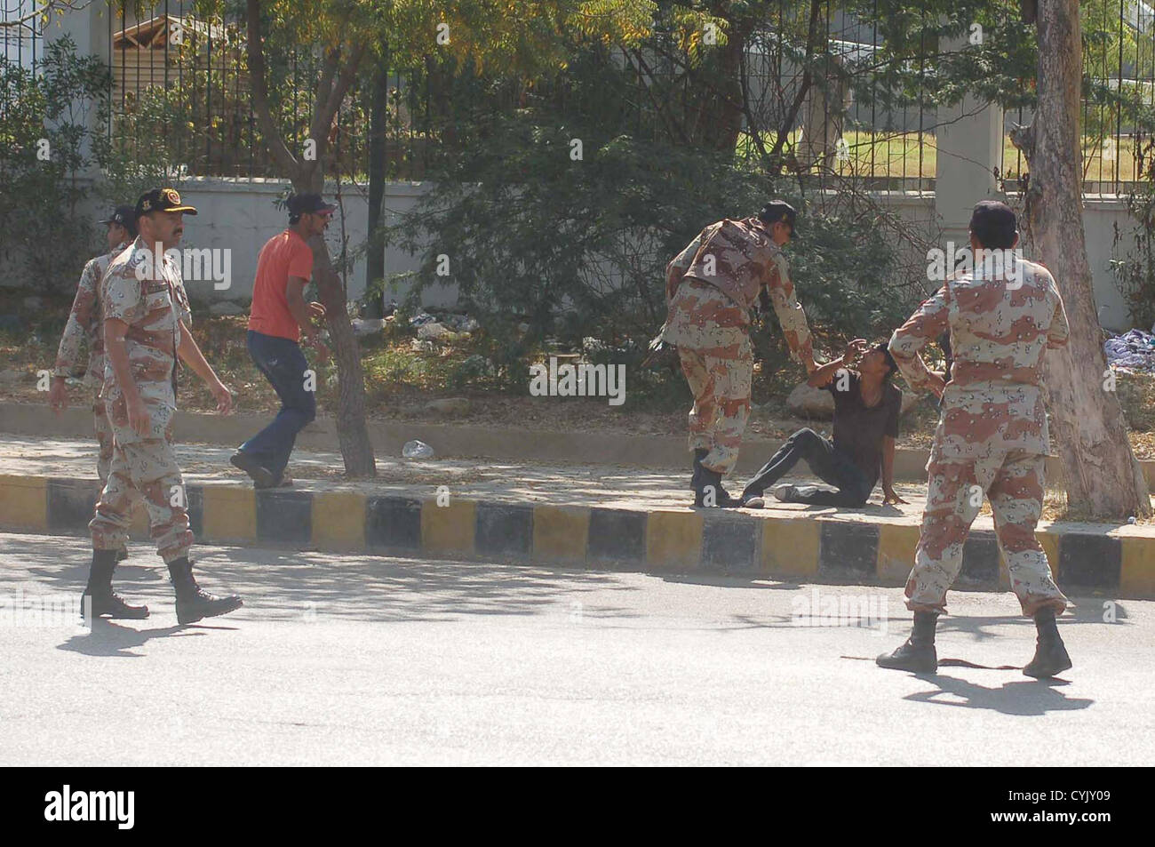 Rangers officials arrest dubious persons during protest  demonstration of Shiite Muslim against target killing of renowned Shiite Muslim Scholar,  Allama Aftab Hyder Jafri, at M.A Jinnah Road in Karachi on Tuesday, November 06, 2012.  Two people, including religious scholar and leader Allama Aftab Haider Jafri, were killed  when unidentified gunmen opened fire on their vehicle at a car parking in Saddar area. Stock Photo