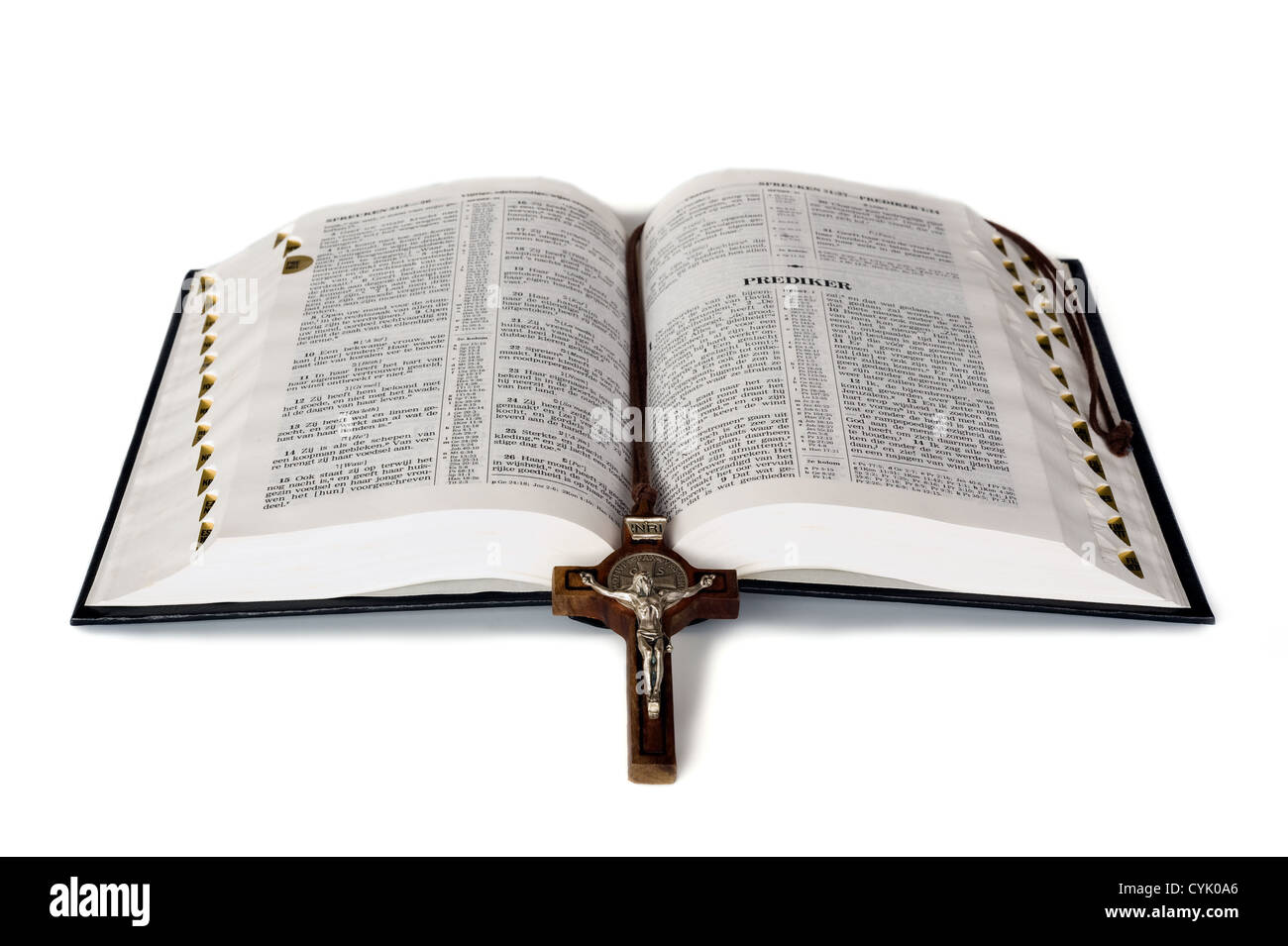 An open bible with a cross in between Stock Photo - Alamy