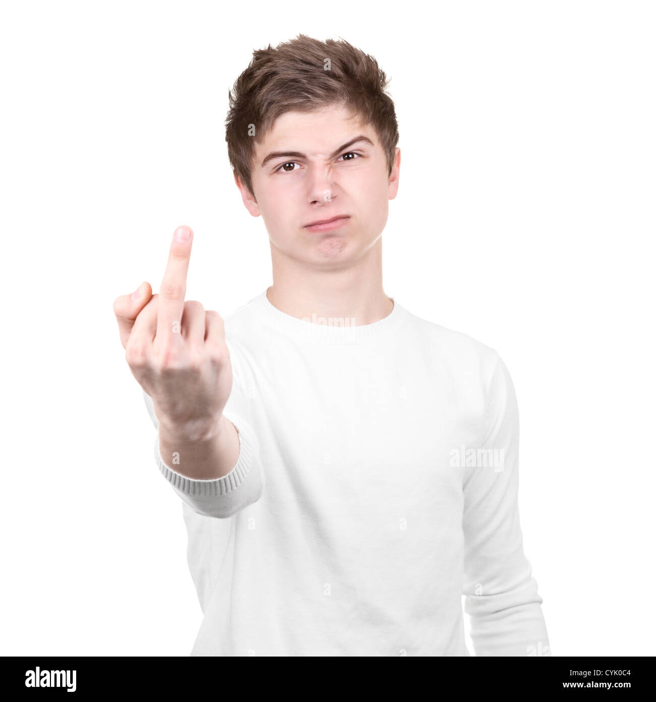 Angry teenager shows rude gesture on a white background Stock Photo