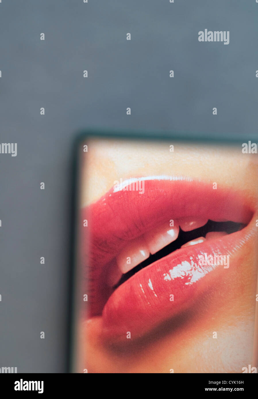 female mouth reflected on mirror Stock Photo