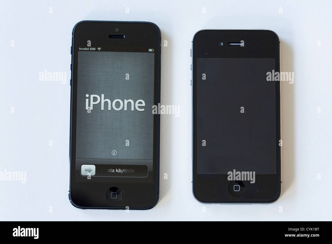 The Apple iPhone 5, left, compared with an Apple iPhone 4S, right.  Stock Photo