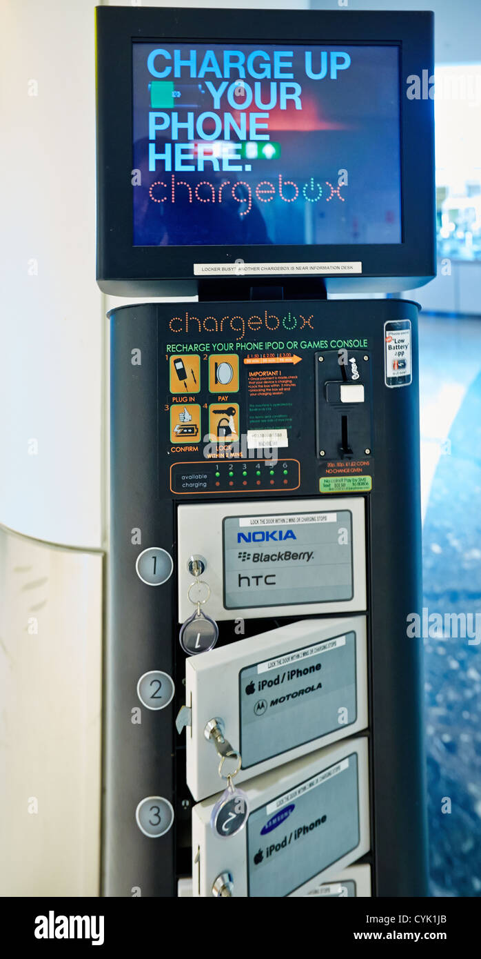 Paidfor mobile phone charging point at Gatwick Airport, London Stock
