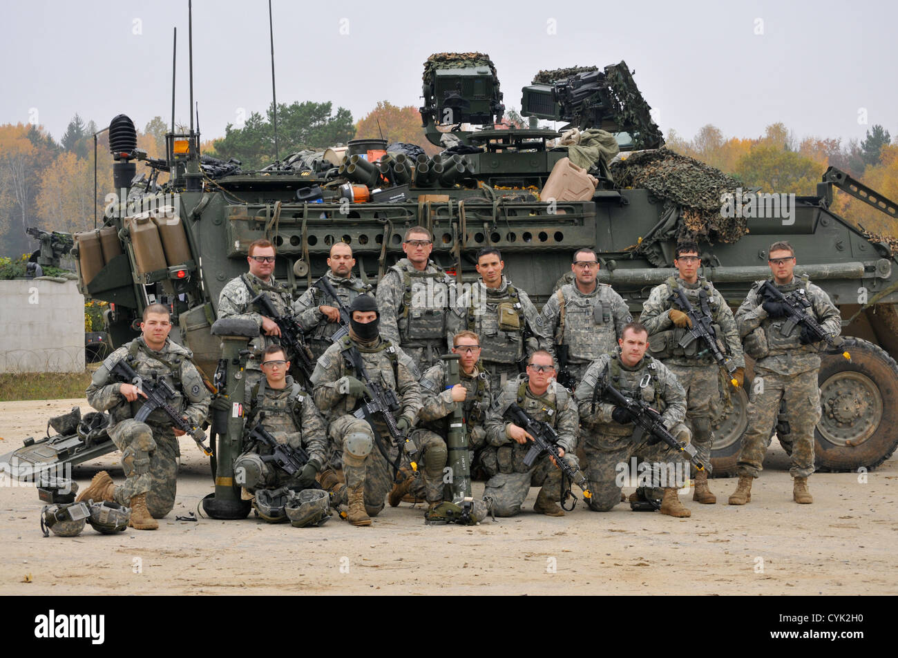 U.S. Army Soldiers, 4th Squadron, 2nd Cavalry Regiment, gather in front of a Stryker armored vehicle during a decisive action training environment exercise, Saber Junction 2012, at the Joint Multinational Readiness Center in Hohenfels, Germany, Oct. 25, 2 Stock Photo