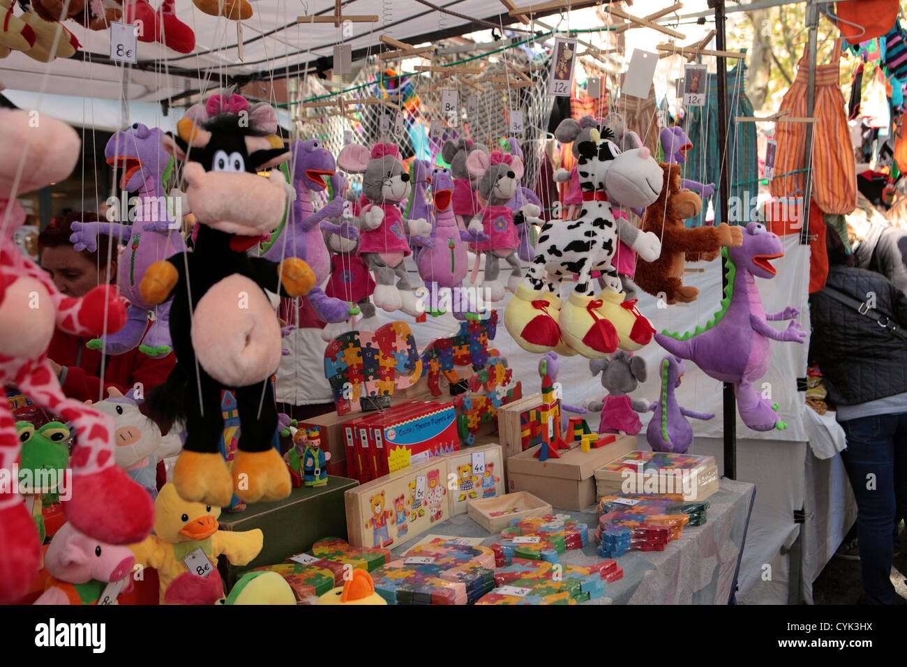 Puppets and children's toys for sale street market stall, El Rastro, Madrid, Spain Stock Photo