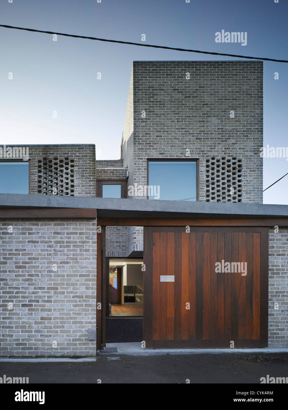 Mews Houses, Dublin, Ireland. Architect Grafton Architects, 2009. View of front facade showing