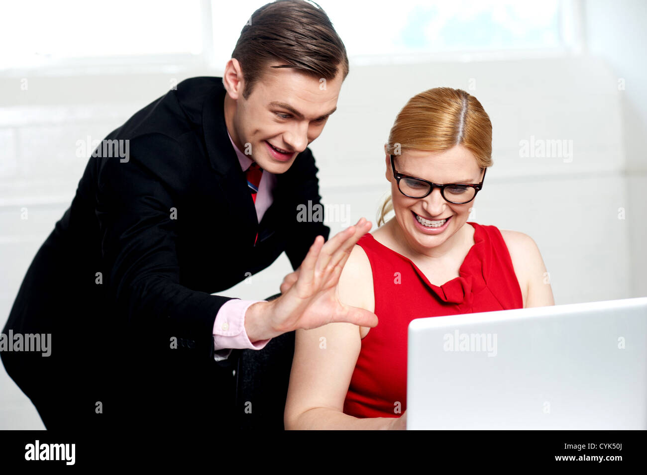 Business people having fun at work. Man expressing something with hands ...
