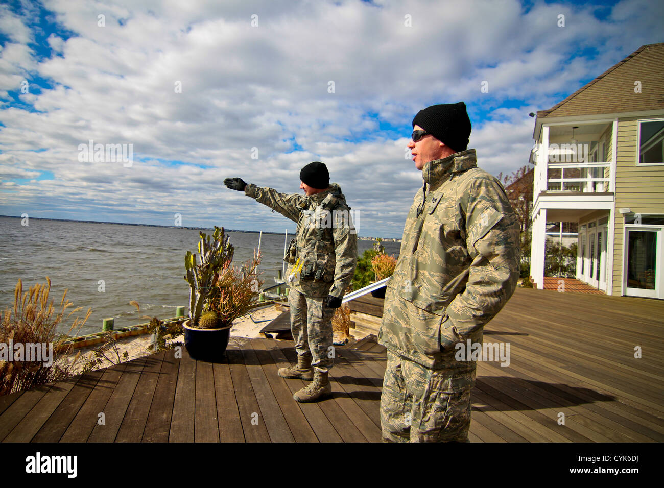 New Jersey Air National Guardsmen from the 108th Wing provide security overwatch of the bay to look for potential looters on Nov 3. The 108th Wing members are assisting law enforcement in securing the beach areas of Brick Township. New Jersey Stock Photo