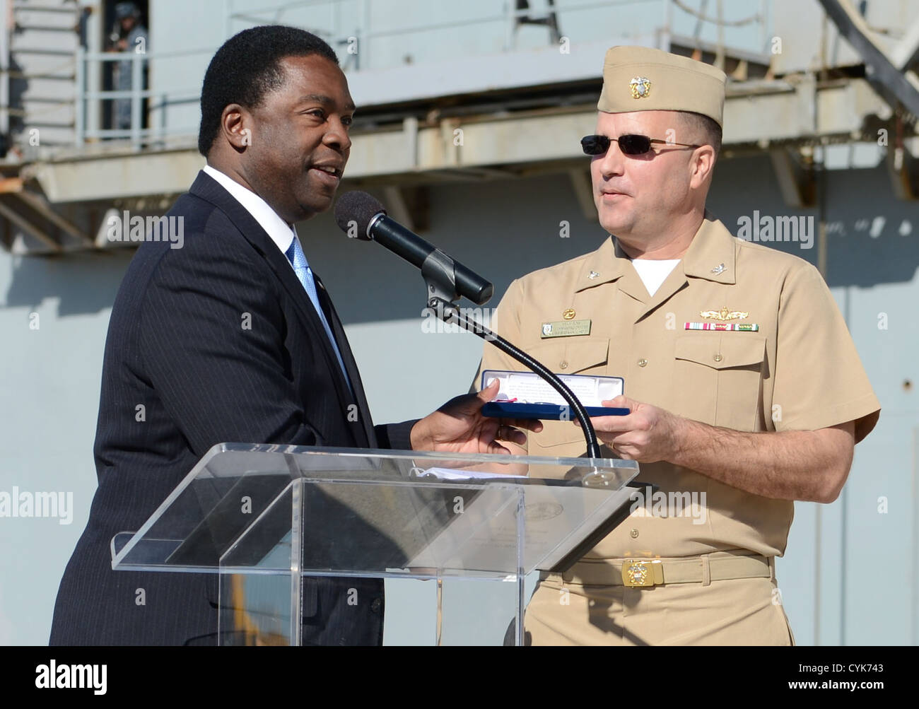 City of Jacksonville Mayor Alvin Brown awards the keys to the city to Capt. Erik Ross, the commanding officer of USS Bataan (LHD 5), upon the ship's arrival at Naval Station Mayport. Stock Photo