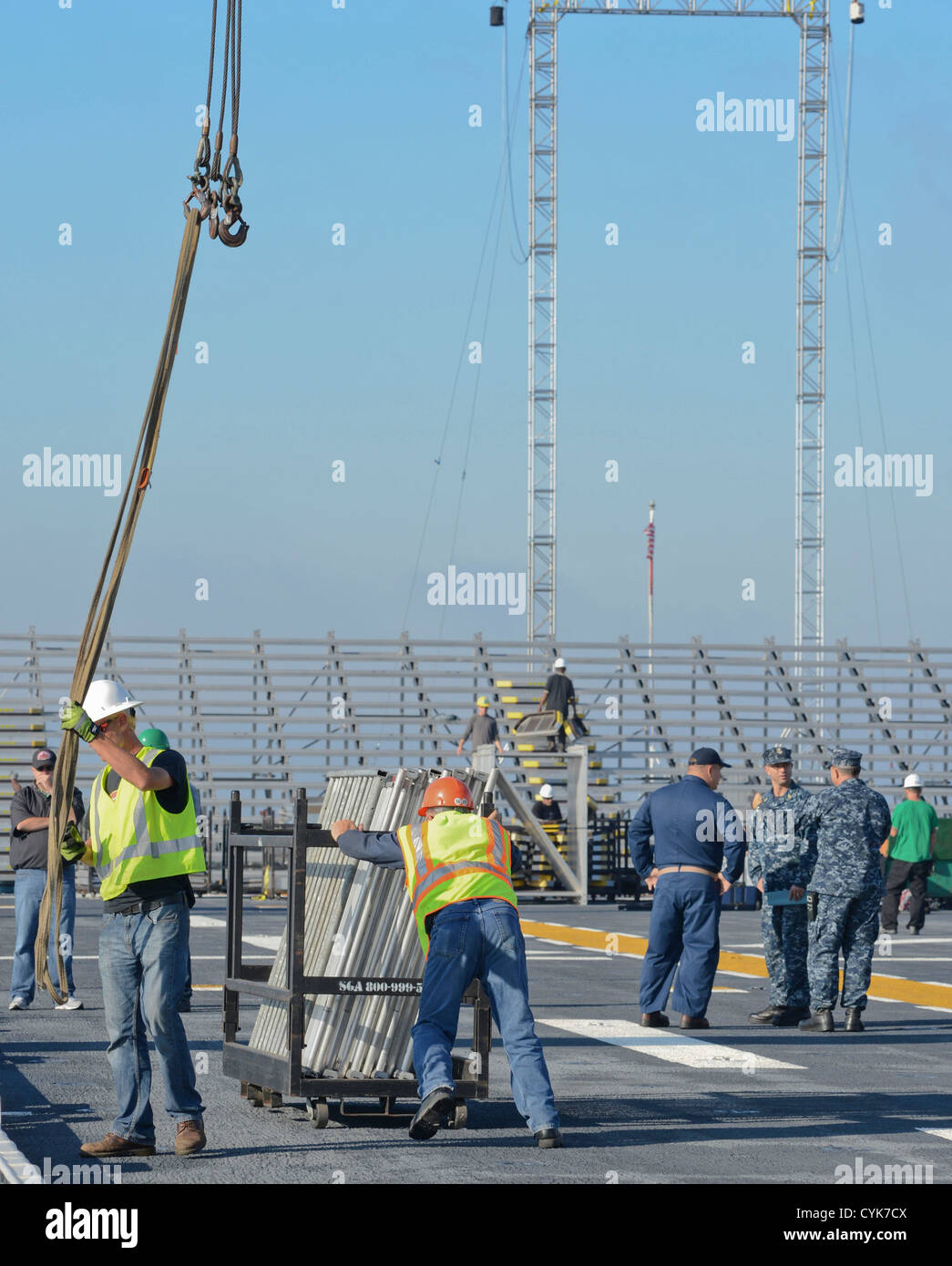 MAYPORT, Fla. (November 3, 2012) -- Workers from MUSCO construction company along with Sailors from USS Bataan (LHD 5) transform Stock Photo