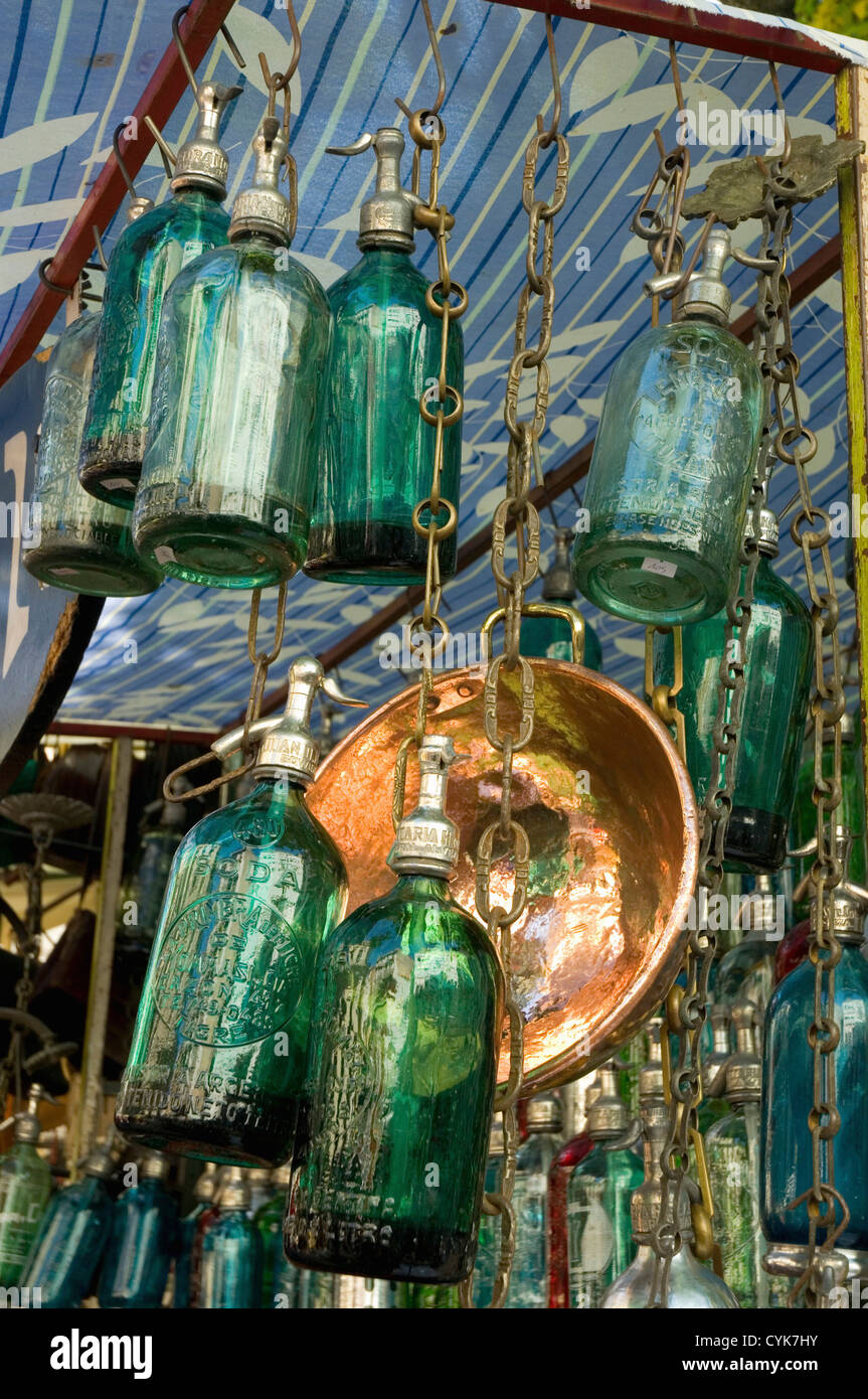 Argentina. Buenos Aires. San Telmo. Flea Market. Stall selling colorful antique siphon bottles. Stock Photo
