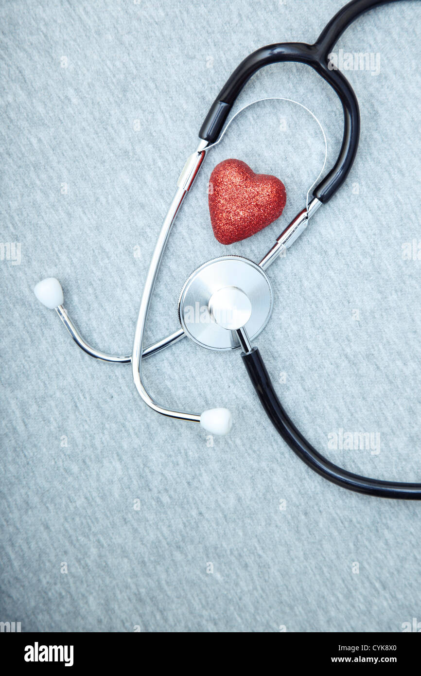 Medical stethoscope and heart on a blue textured background Stock Photo ...
