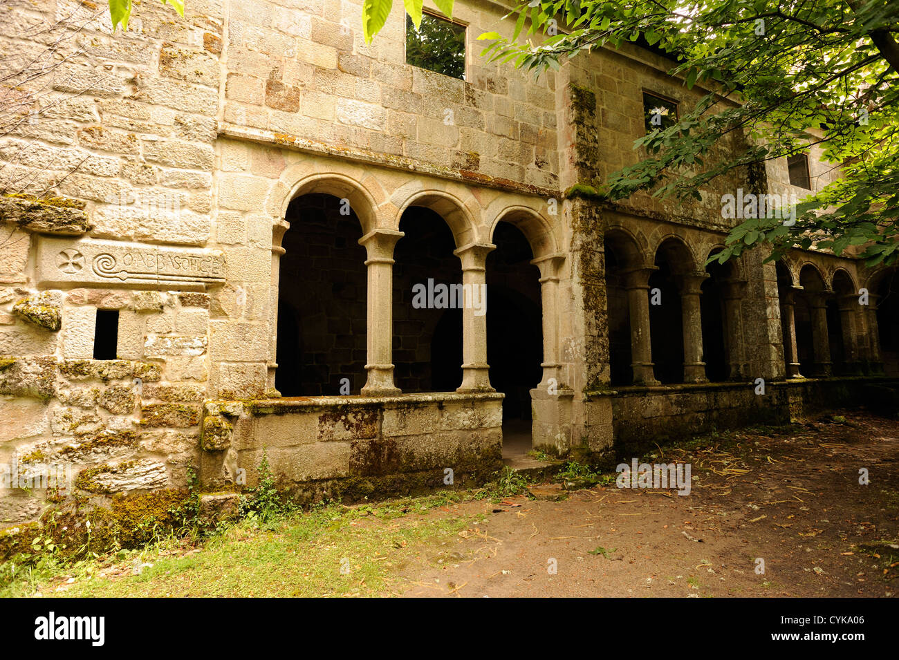 Arched cloister and courtyard in a deserted monastery or hermitage in the Sil valley.  Esgos,  Galicia, Spain Stock Photo