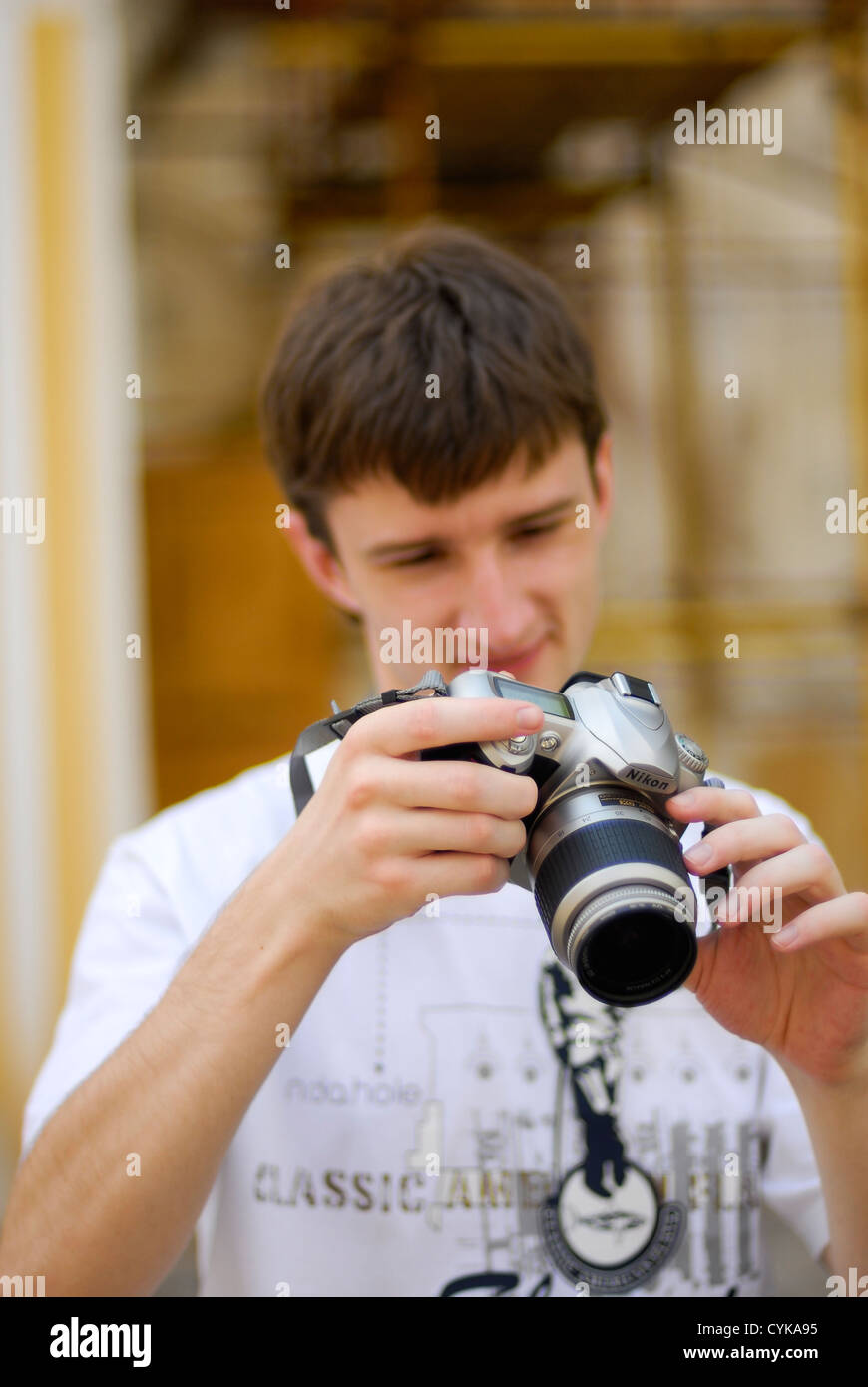portrait young man dslr camera Stock Photo - Alamy