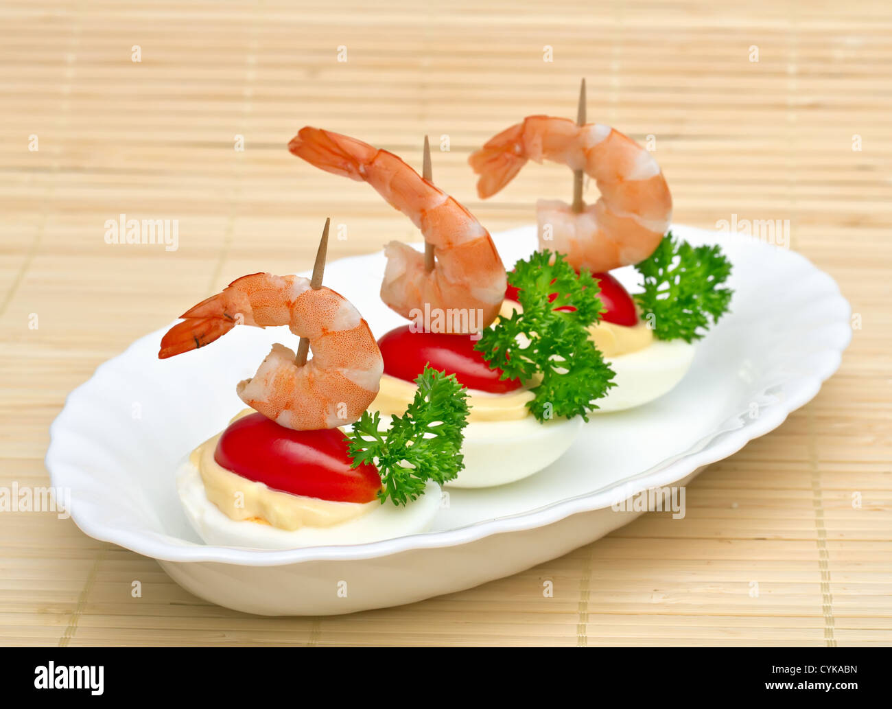 Canape with egg and a shrimp Stock Photo - Alamy