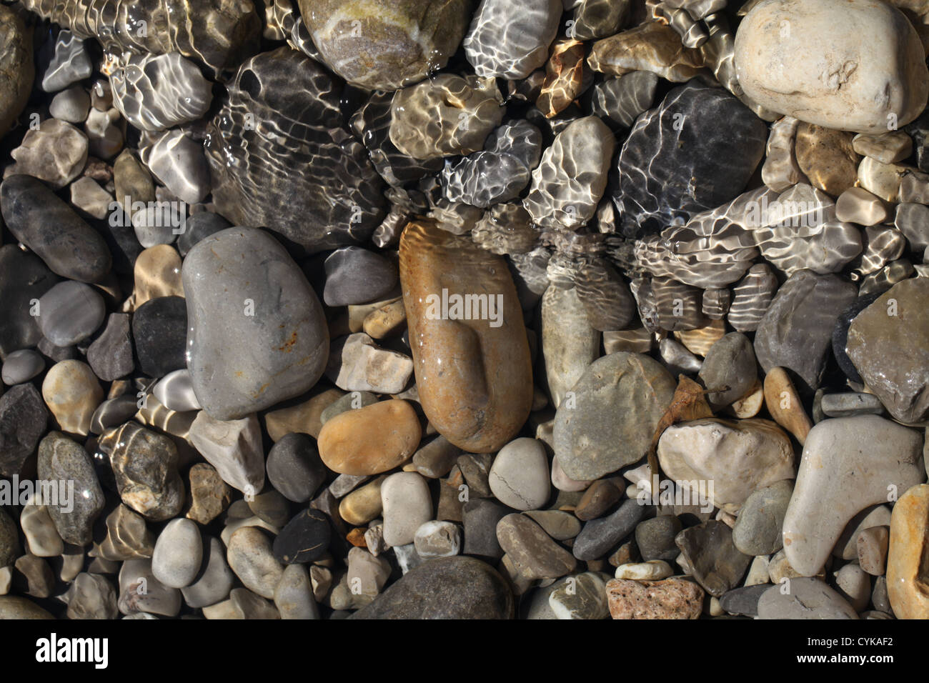 Pebbles On The River Bed Stock Photo - Alamy