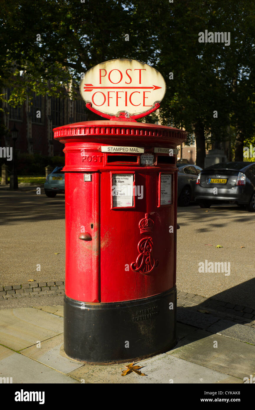 Lincoln's Inn Fields, Holborn, London, England. Post office sign on red post, or mail, or letter box. Stock Photo
