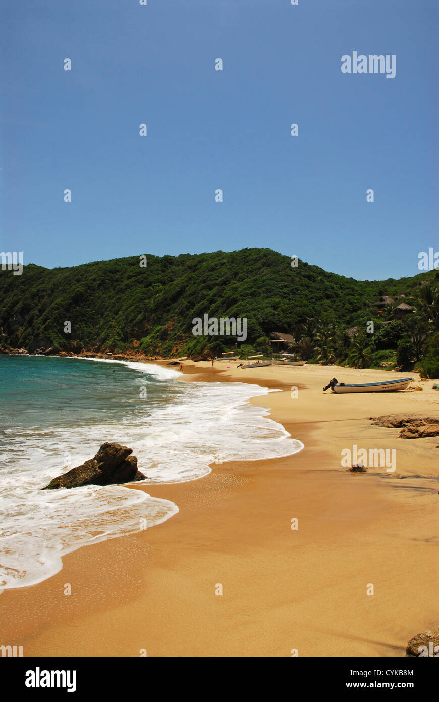 Mexico, Mazunte, scenic view of beach with mountains and houses in the