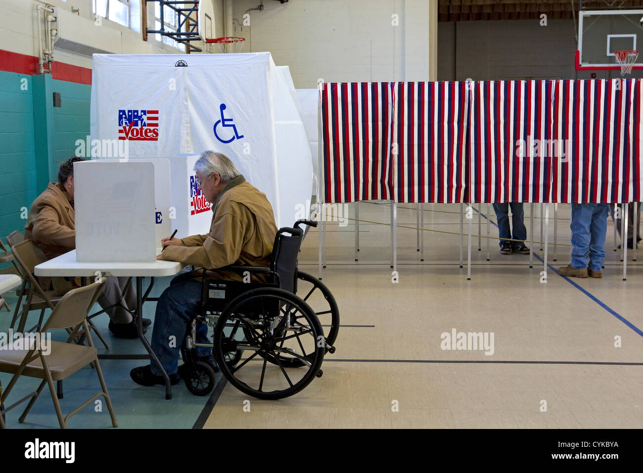 A New Hampshire voter with a disability casts his ballot for United