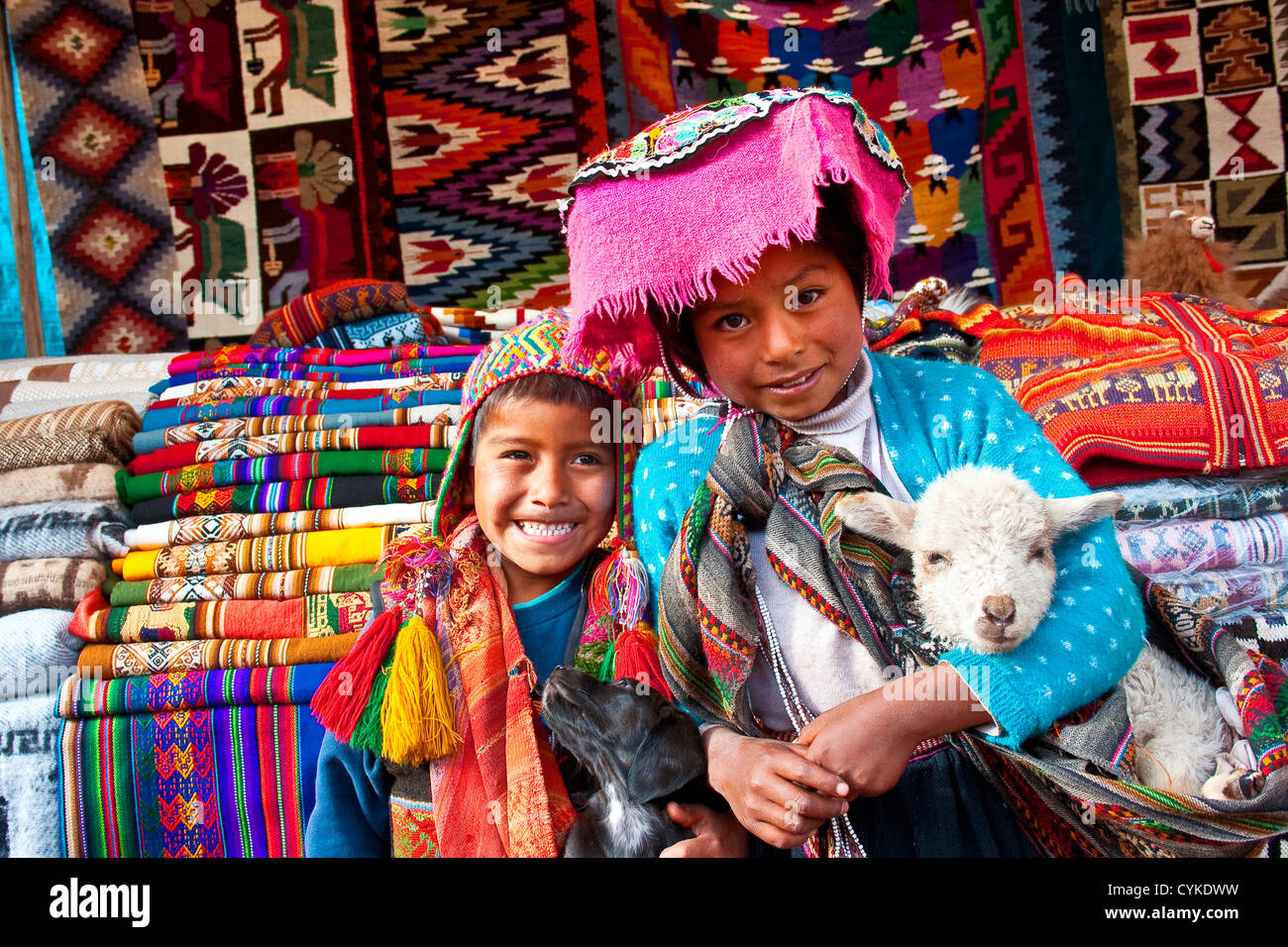 Pisac, Peru, A local boy and girl dressed in traditional clothing pose