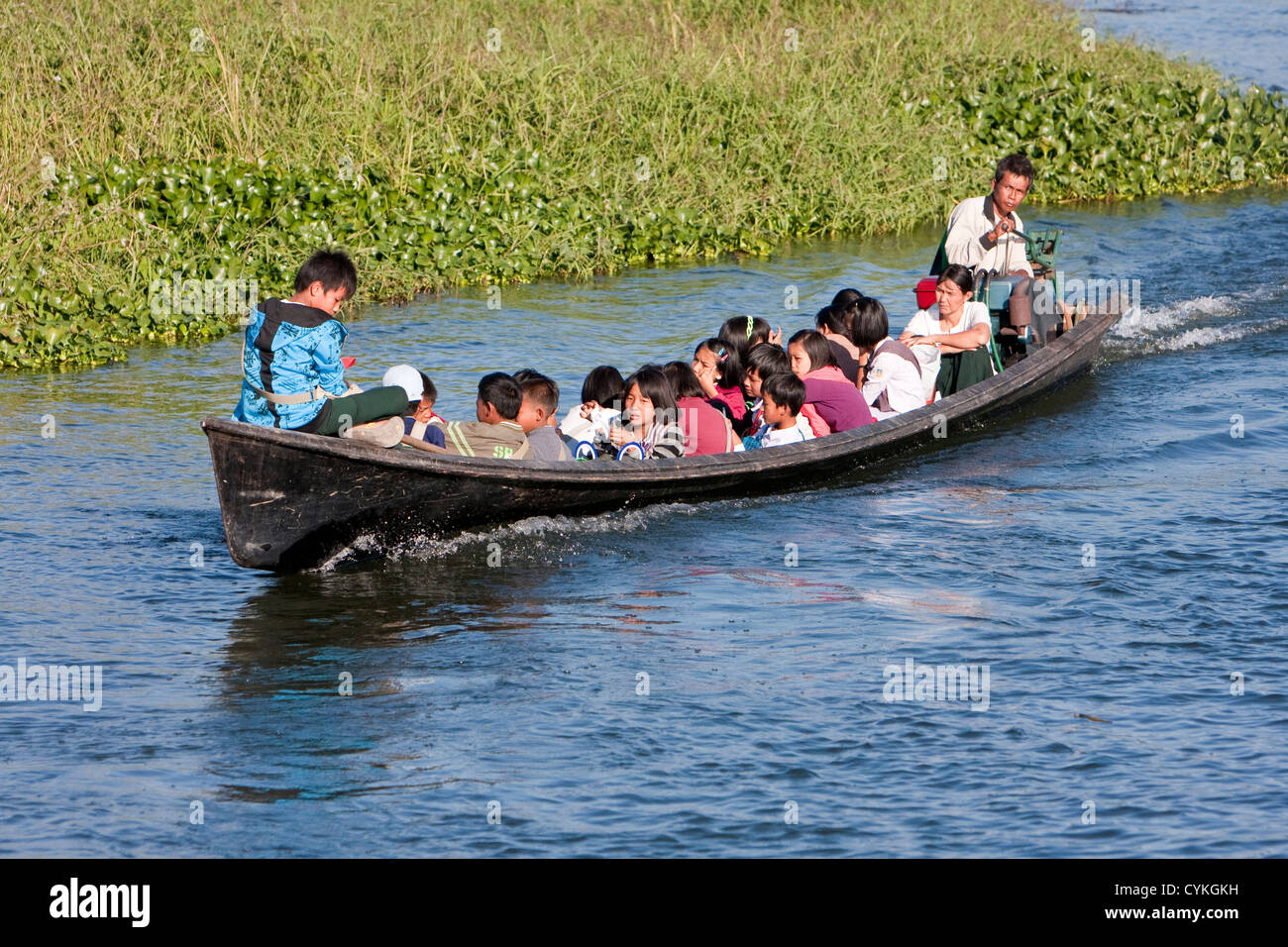 Myanmar, Burma. School Children Riding Home after School, Inle Lake, Shan State. Stock Photo