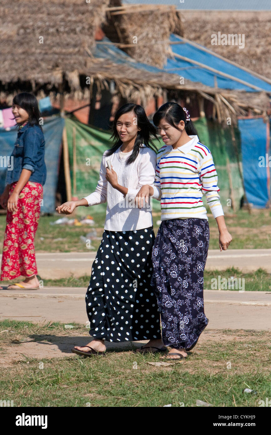Myanmar, Burma. Two Young Burmese Women Talking, Inle Lake, Shan State. Stock Photo