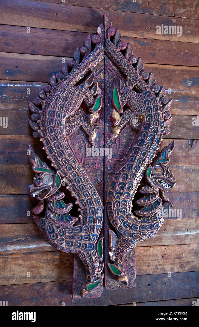 Myanmar, Burma. Double Hand-carved Dragon Mounted on Wall, Inle Lake, Shan State. Stock Photo