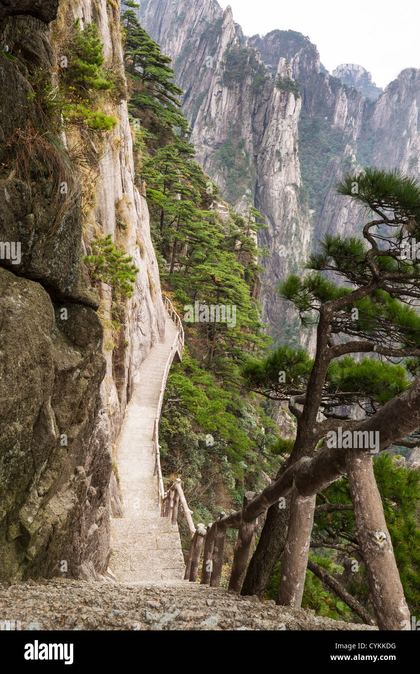 Very steep staircase into China's Yellow Mountain Pass Stock Photo