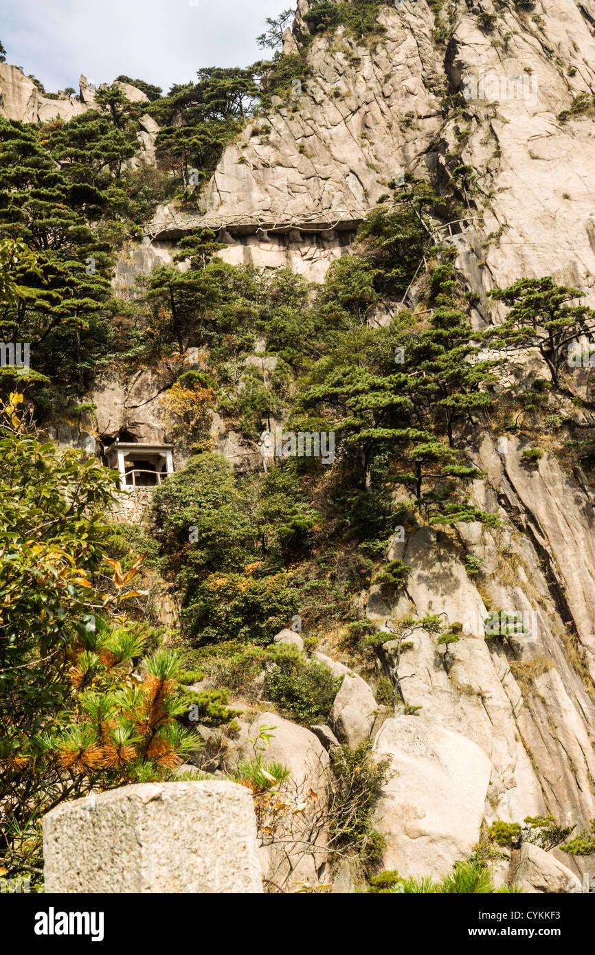 Narrow and steep staircase on yellow mountain in China Stock Photo