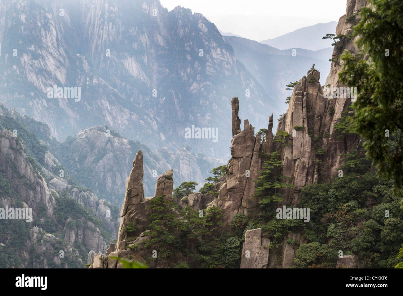 Large Vertical rocks in China's Yellow Mountains with misty sky in ...