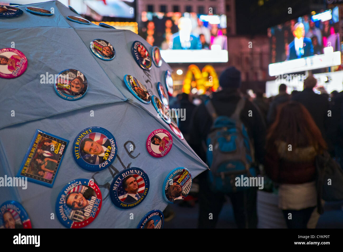 November 7, 2012, New York, NY, US.  Obama and Romney campaign buttons for sale as crowd in Times Square celebrates President Barack Obama's reelection victory in the 2012 United States presidential election. Stock Photo