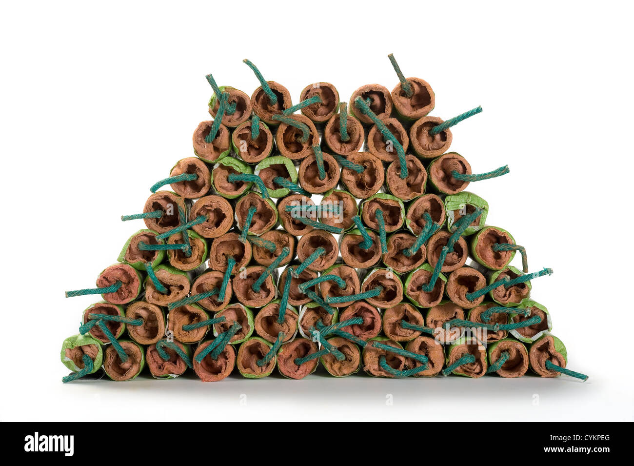 A lot of stacked firecrackers with green fuse Stock Photo