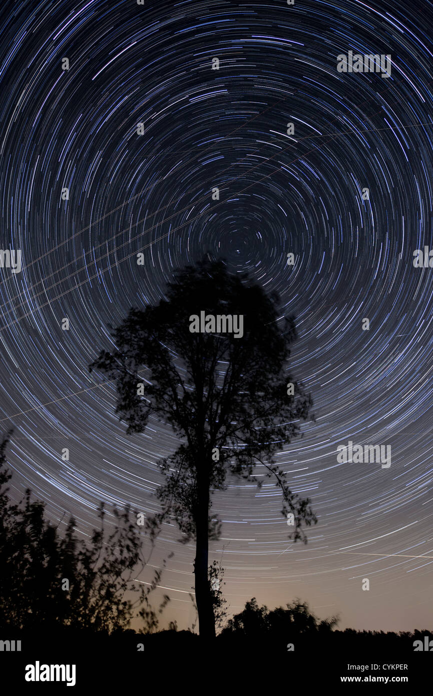 A 53 minute exposure of the sky in the Netherlands with crossing airplanes and satellites Stock Photo