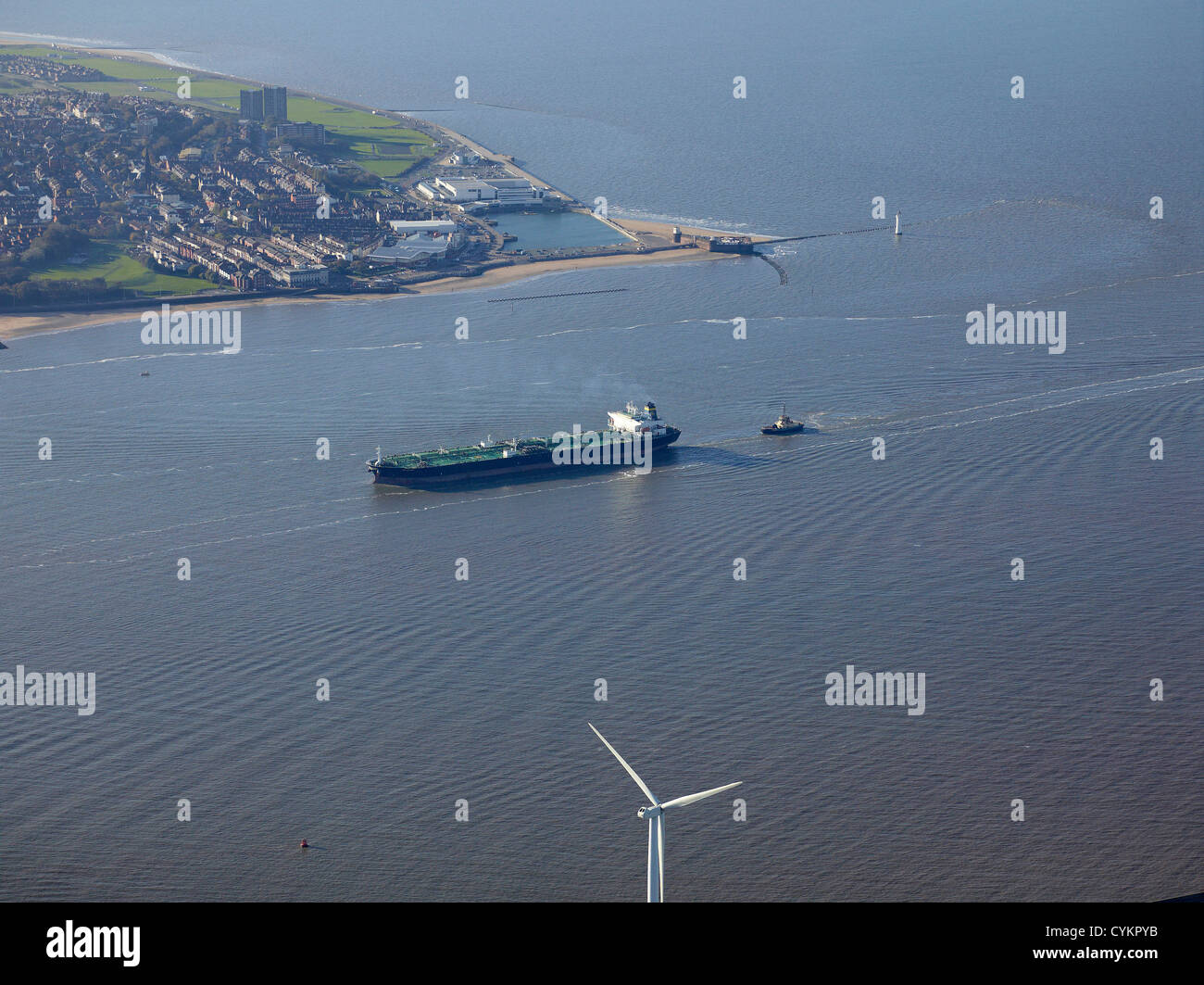 Oil tanker entering at the mouth of the River Mersey, North West England, UK with the Wirral behind Stock Photo