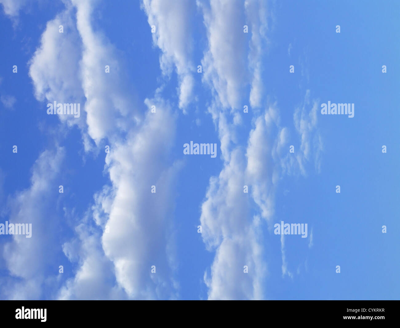 Blue sky with white clouds - vertical image Stock Photo - Alamy