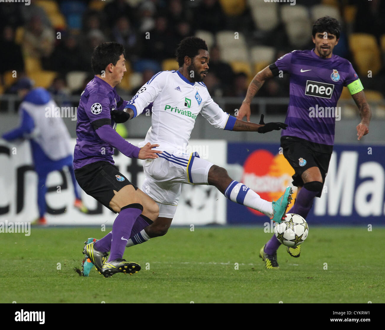 06.11.2012 Andre Castro(L), Lucho Gonzalez(R) of Porto and Lukman Haruna (C) of Dynamo Kiev during their UEFA Champions League, Group stage (Group A) soccer match of Ukrainian FC Dynamo Kiev vs FC Porto of Portugal on the Olimpiyskiy stadium in Kiev. Stock Photo